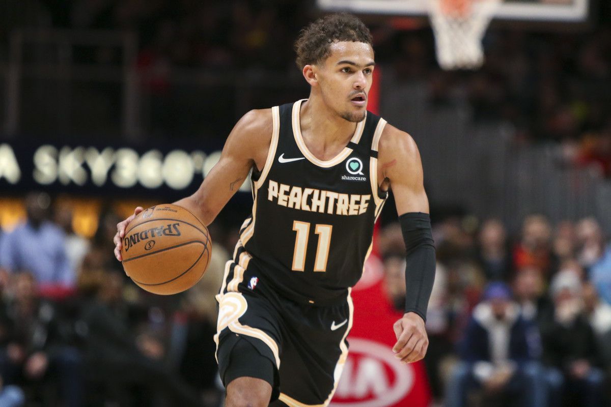 Atlanta Hawks guard Trae Young (11) dribbles against the Miami Heat